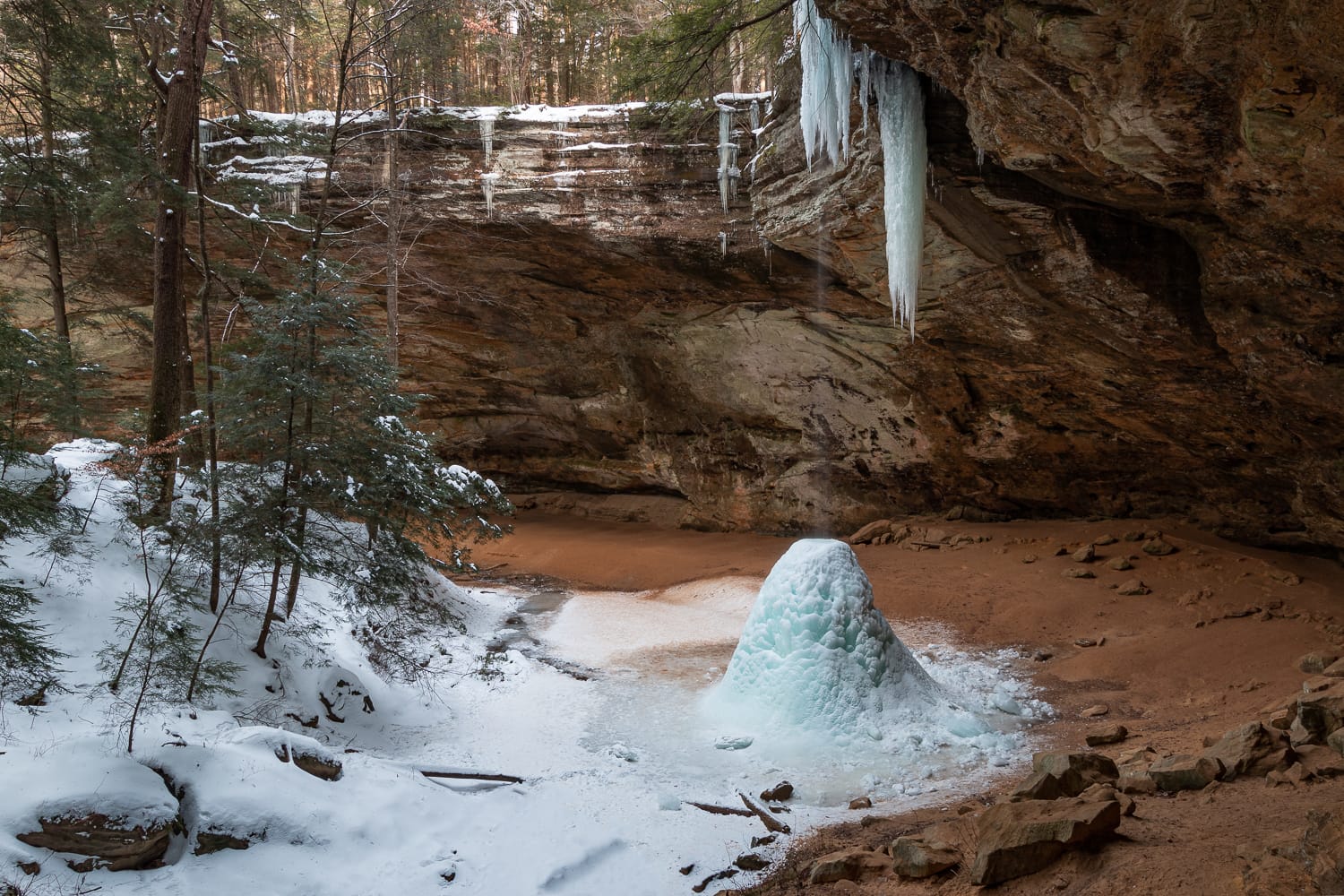The waterfall at Ash Cave partially frozen - Hocking Hills, Ohio
